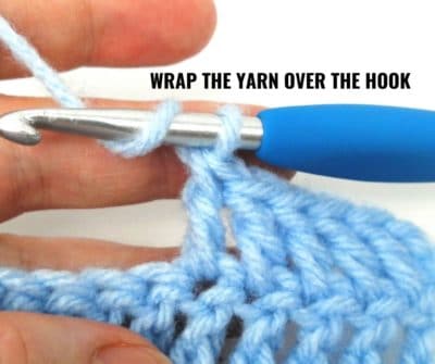 Step 1 - Wrap the yarn over the crochet hook.