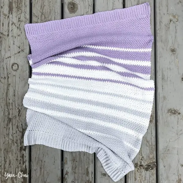 Striped linen stitch crochet blanket.