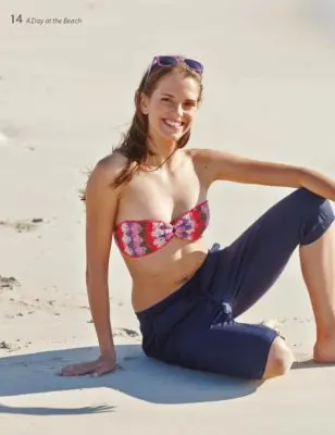 Woman wearing a crocheted bikini top.