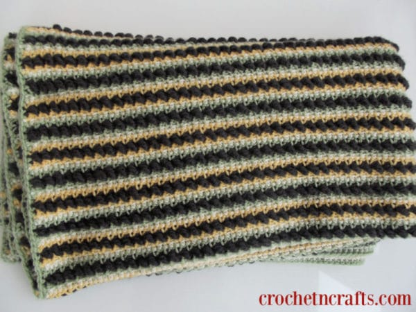 Textured Stripes Crochet Lapghan shown folded up from a closer angle to show stripes and textures.