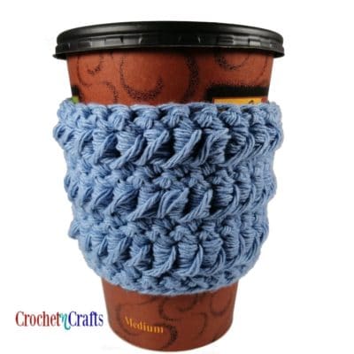 Crochet cup cozy showing the pretty texture from the wrong side.