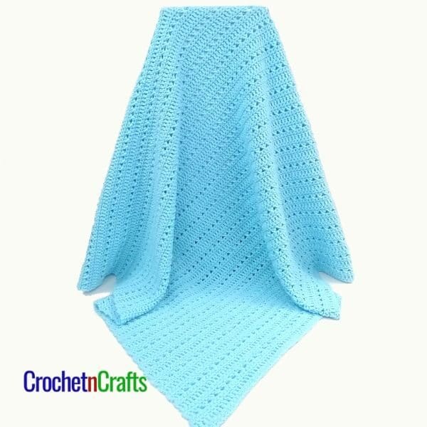 Baby Blanket Draped Over A Box
