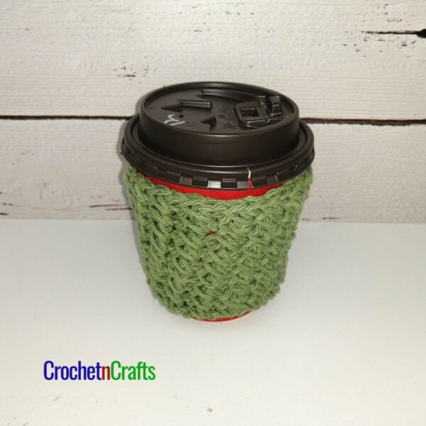 Crochet cup cozy pattern shown take-out coffee cup.