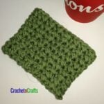 Crochet cup cozy laid flat.