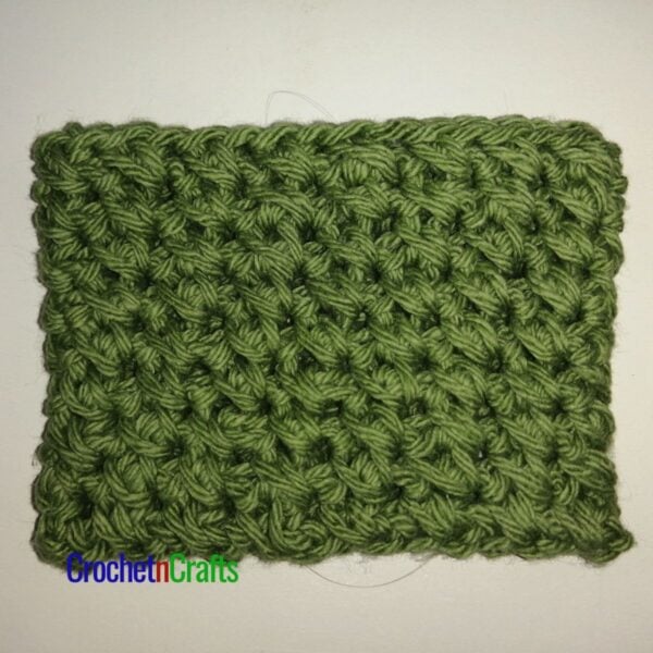 Crochet cup cozy laid flat.