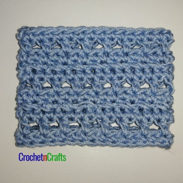 Crochet cup cozy laid flat.