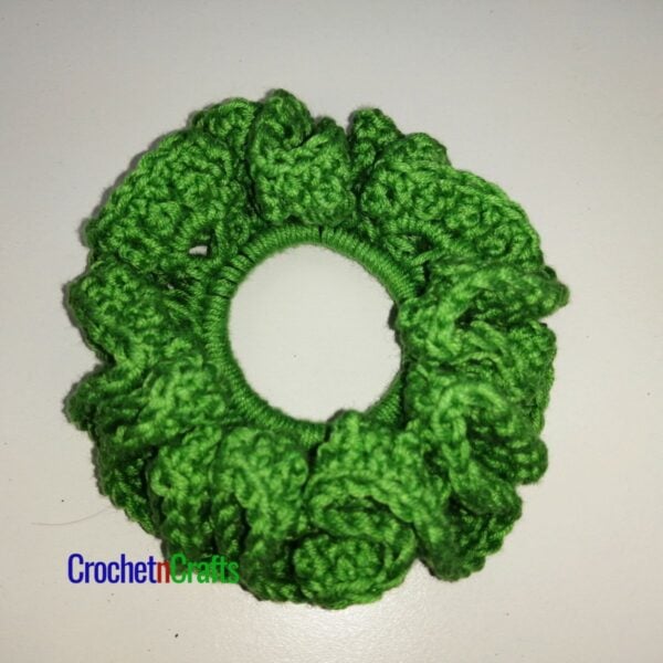 Crochet hair scrunchie shown in green yarn.