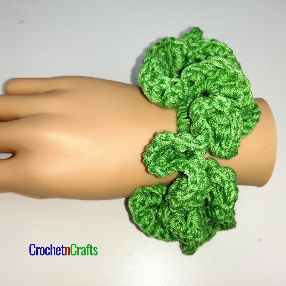 Crochet hair scrunchie worked up in the bullion stitch.