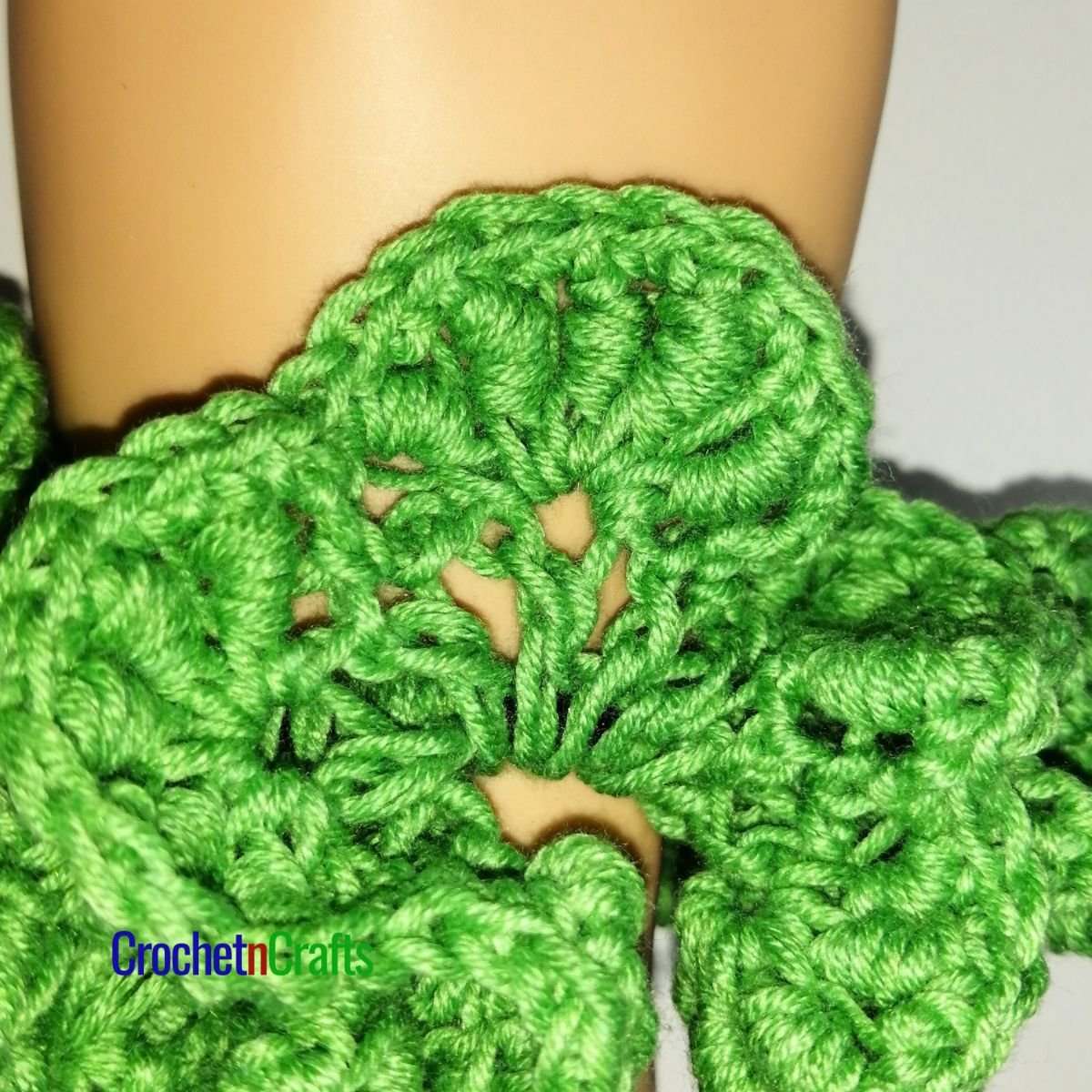 Crochet hair scrunchie worked up in the bullion stitch.