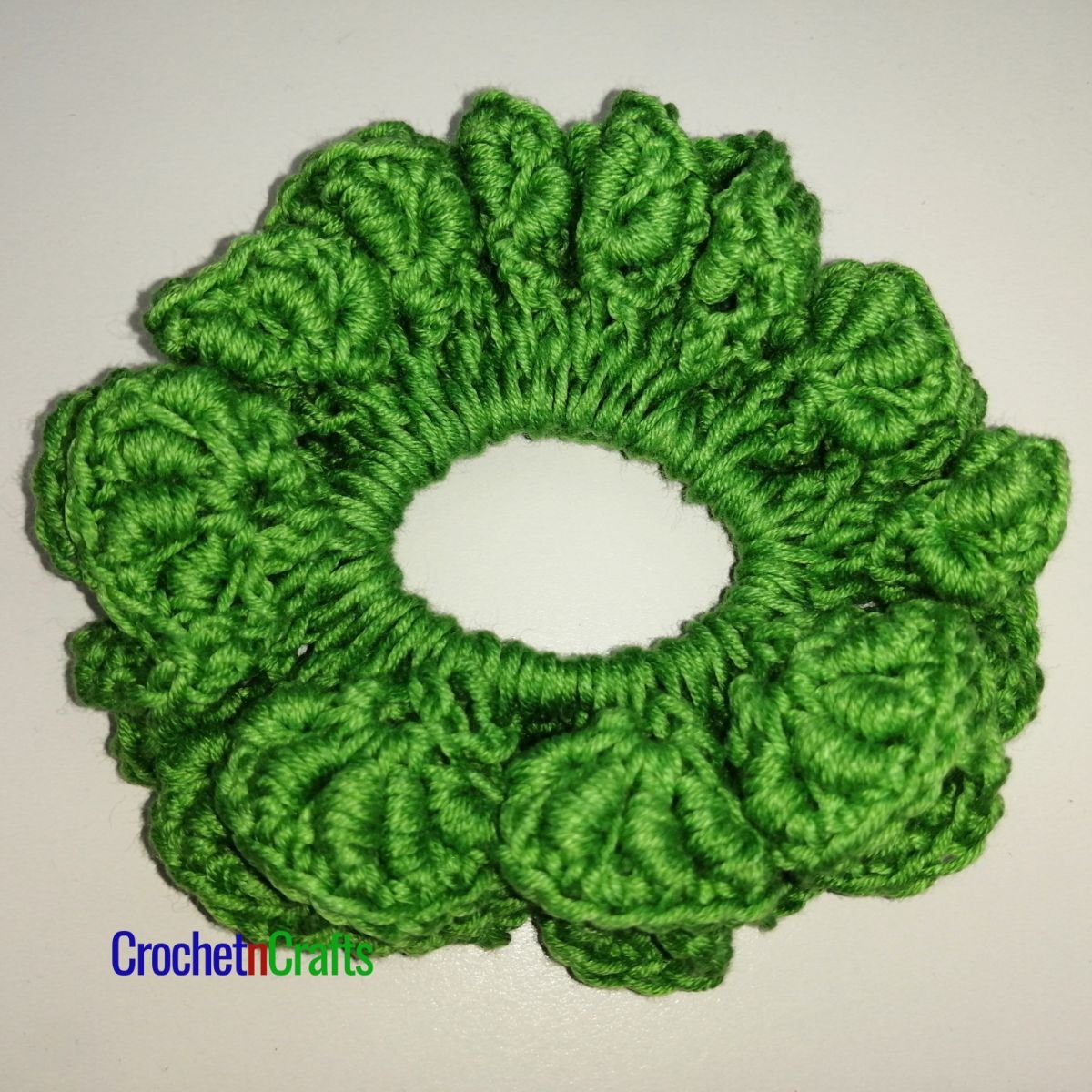 Crochet hair scrunchie worked up in the bullion stitch.