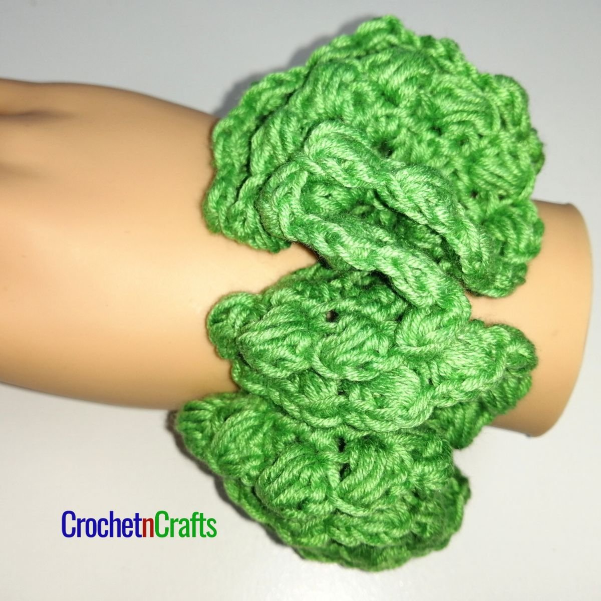 Crochet hair scrunchie pattern worked up in a light yarn.