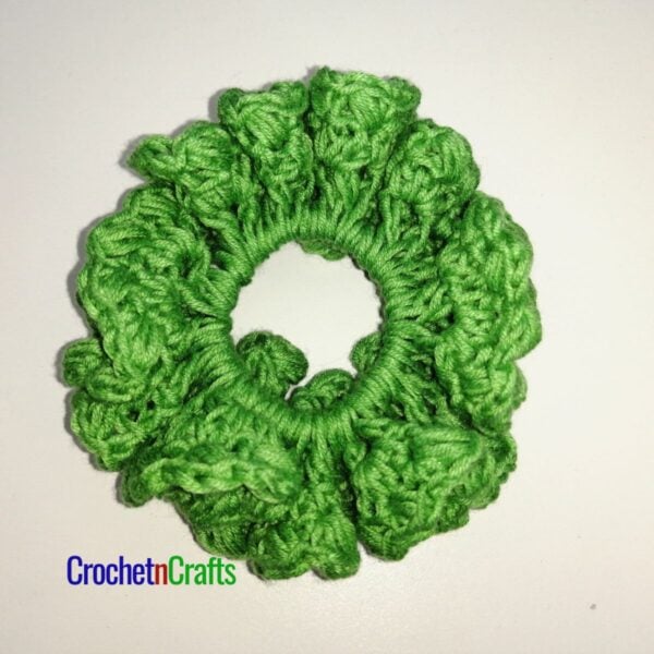 Crochet hair scrunchie pattern worked up in a light yarn.