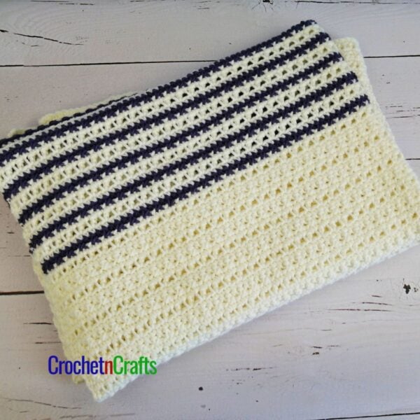 Crocheted blanket folded up.