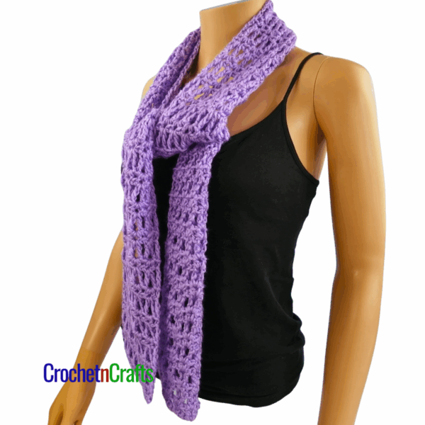 Crocheted scarf shown on a mannequin. Side View