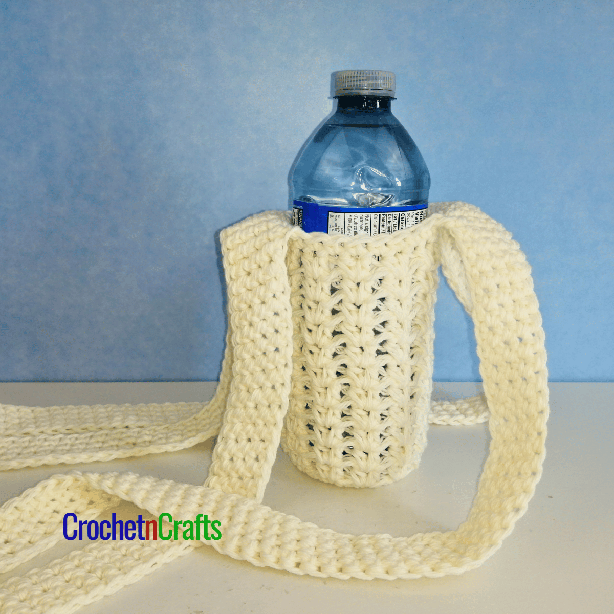 Crochet water bottle holder with a 500ml water bottle.
