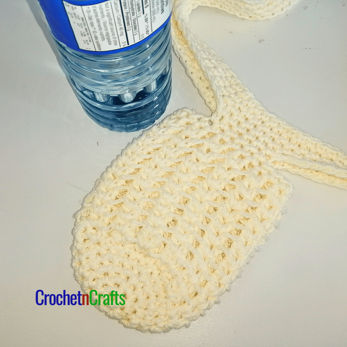 Crochet water bottle holder laid flat.
