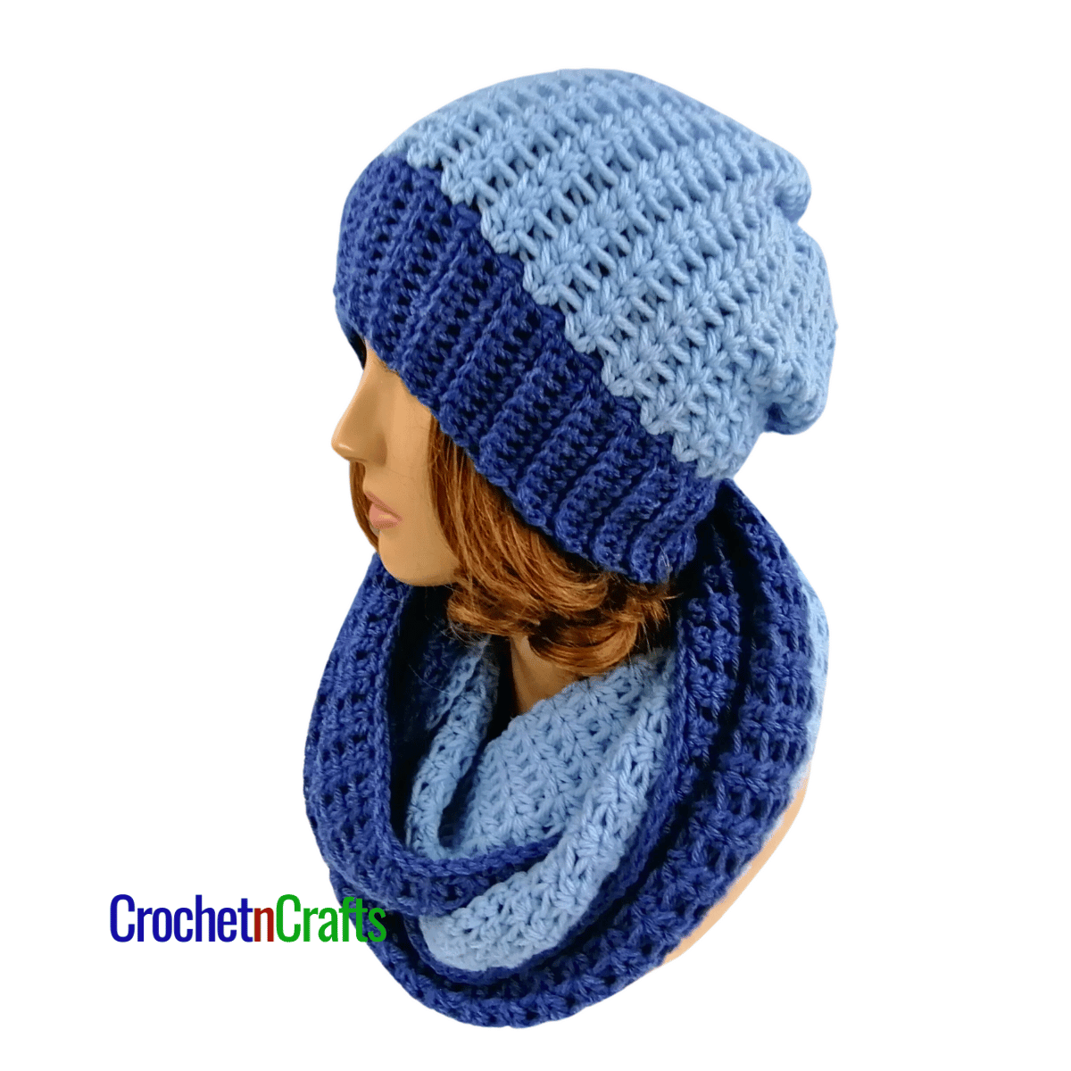 A crochet cowl wrapped cozy around the neck and a matching hat - side view.