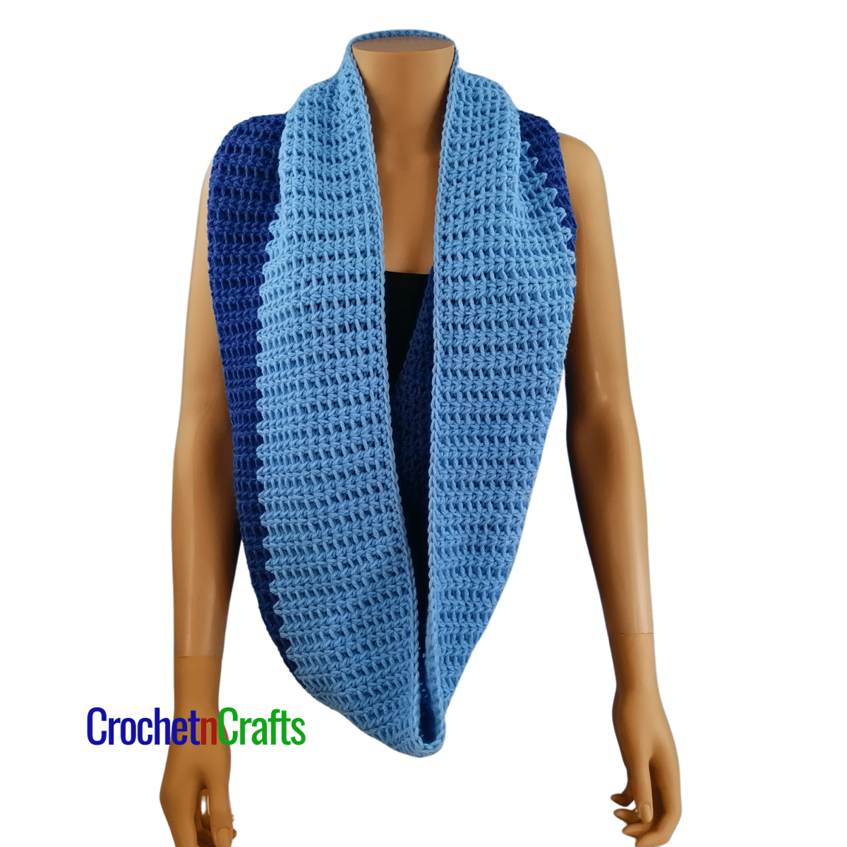 A crochet cowl worn long like a scarf.