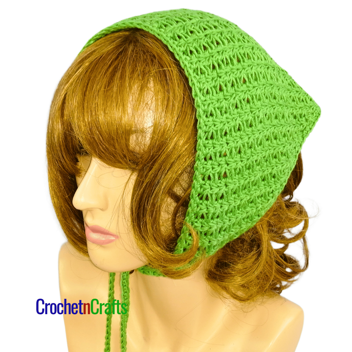 Crochet kerchief shown on a mannequin - tied at the front.