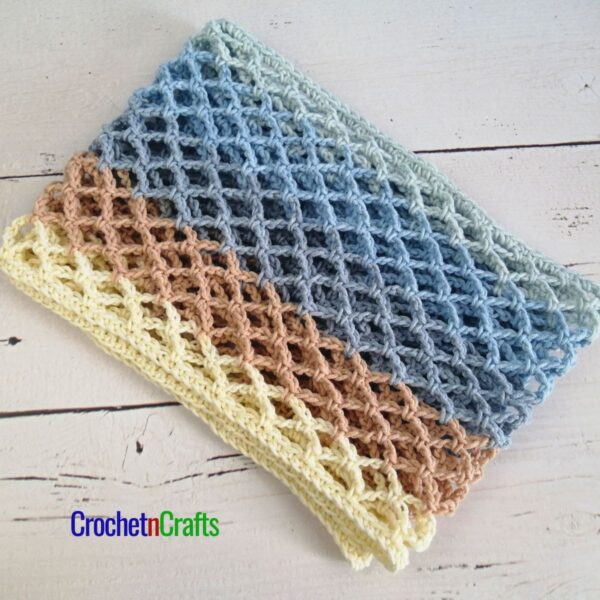 Crochet diamond mesh cowl folded up.