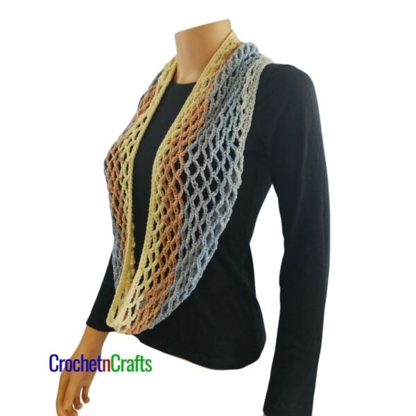 Crochet diamond mesh cowl worn long like a scarf.