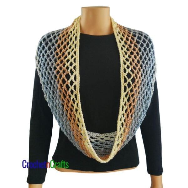 Crochet diamond mesh cowl worn long like a scarf and draped over the shoulders.