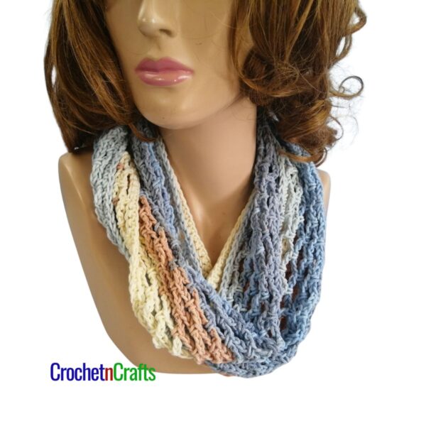 Crochet diamond mesh cowl worn cozy.