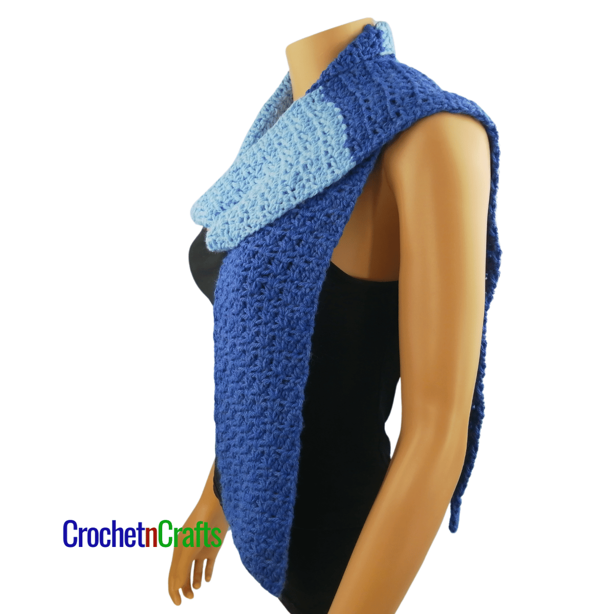 A crocheted scarf worn on the mannequin - draped over the shoulder - side view.