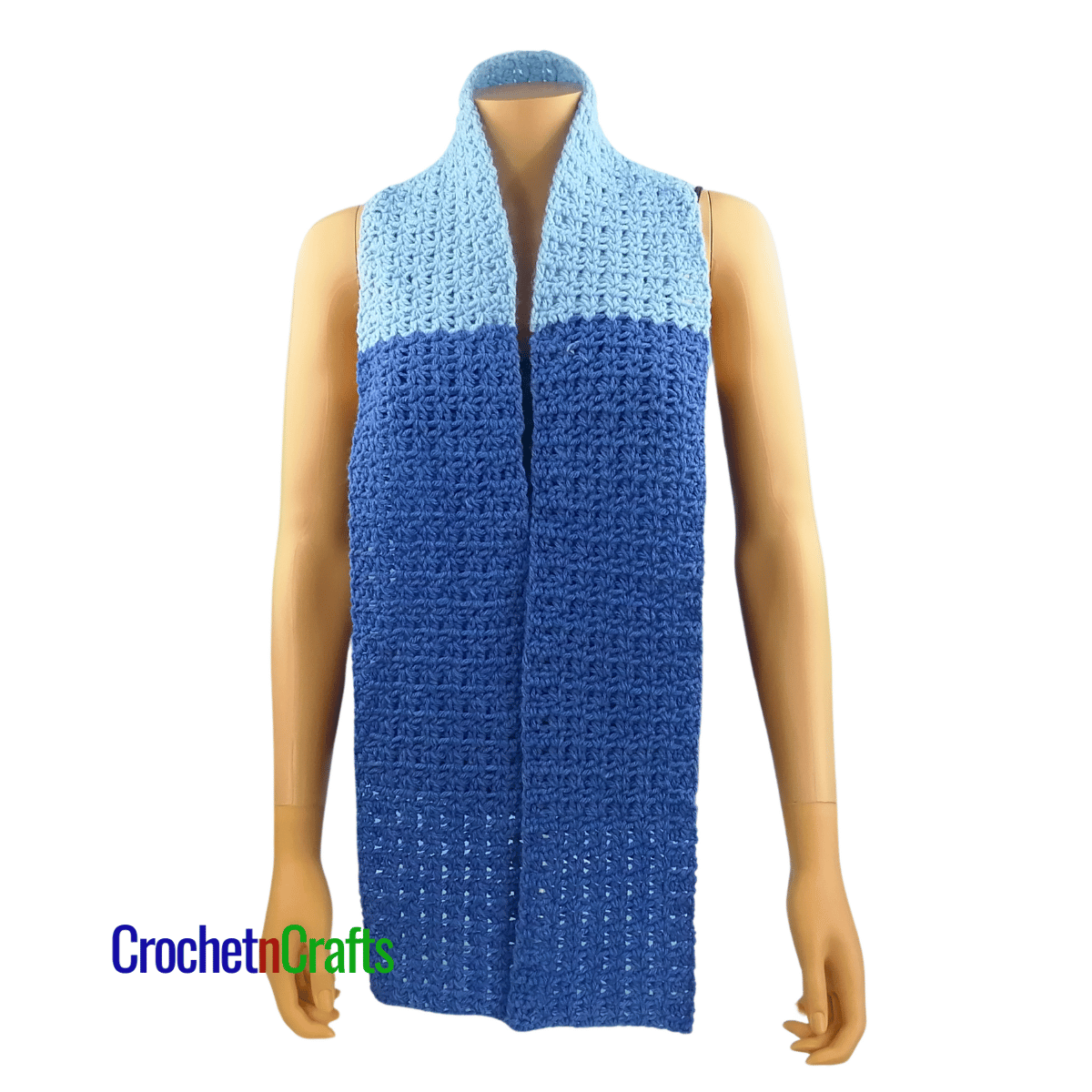 A crocheted scarf worn on the mannequin - worn long.