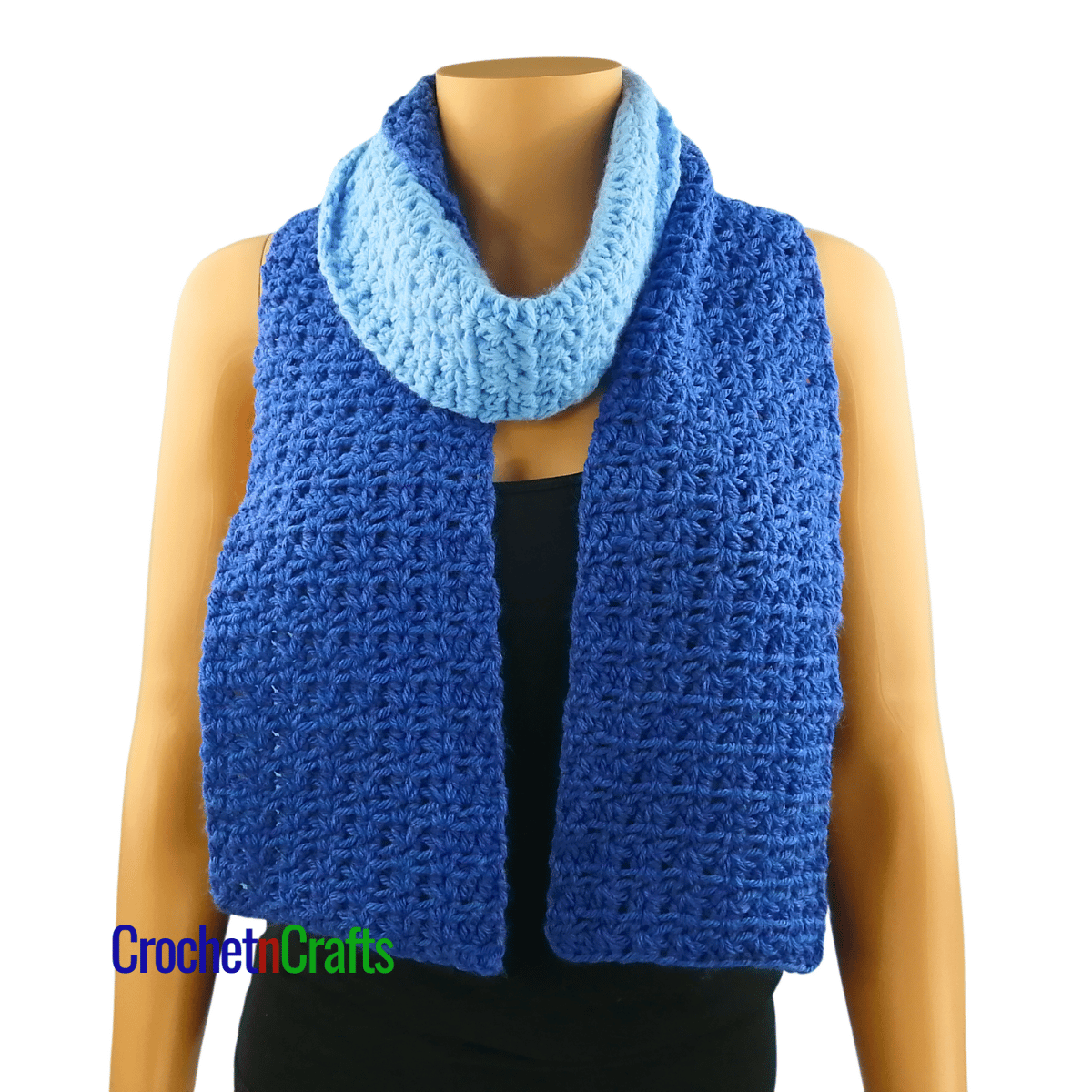 A crocheted scarf worn on the mannequin - wrapped around the neck.