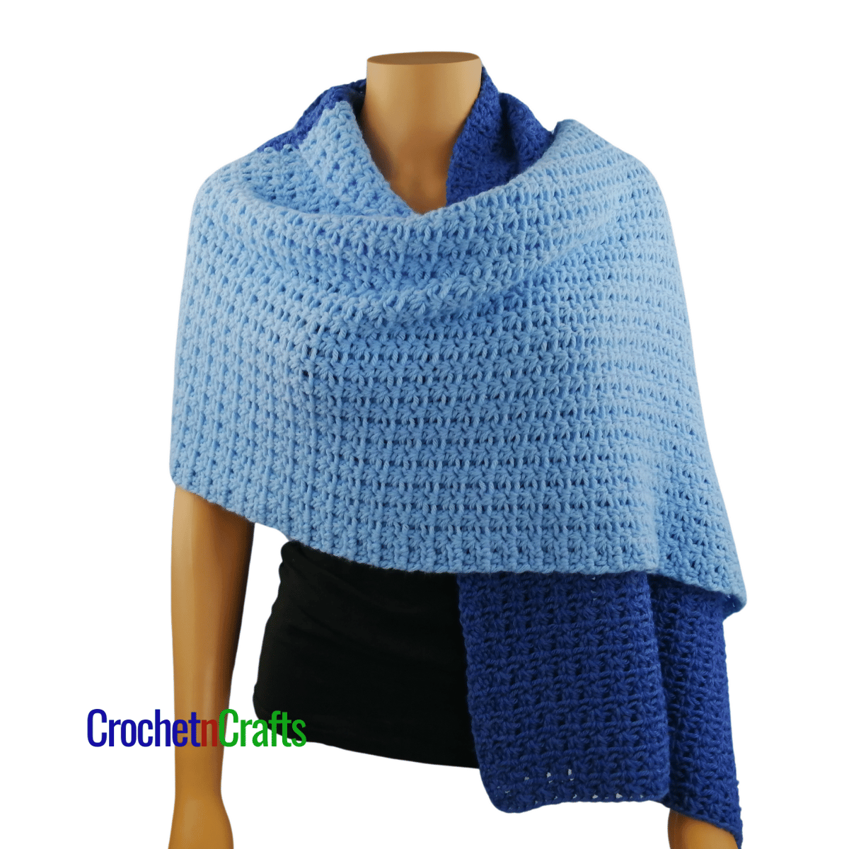 A crocheted shawl worn on a mannequin - front view