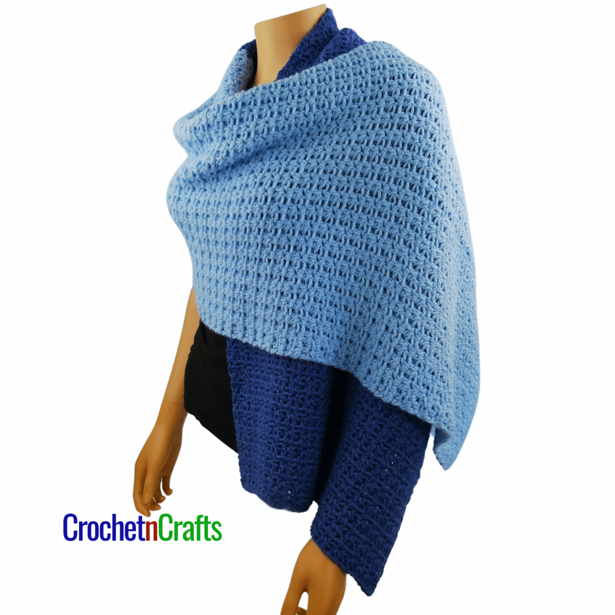 A crocheted shawl worn on a mannequin - another side view