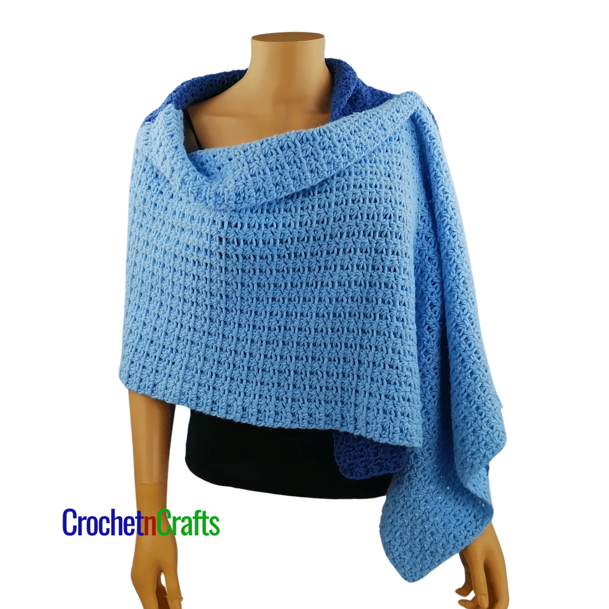 A crocheted shawl worn on a mannequin - front view.
