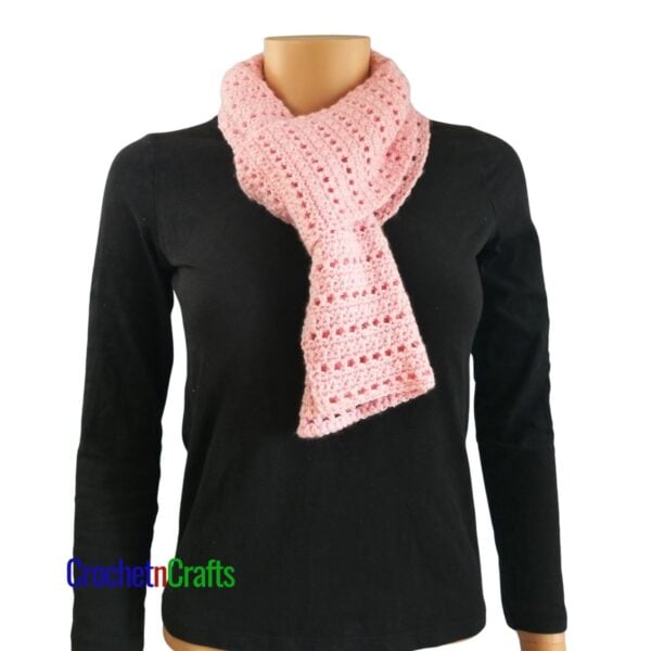 A crocheted scarf looped through for a cozy neck scarf.