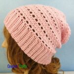 A crocheted lightweight hat pattern modeled on a mannequin.