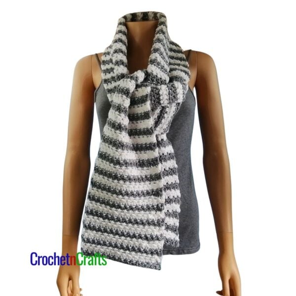 A striped crochet scarf tied at the front.
