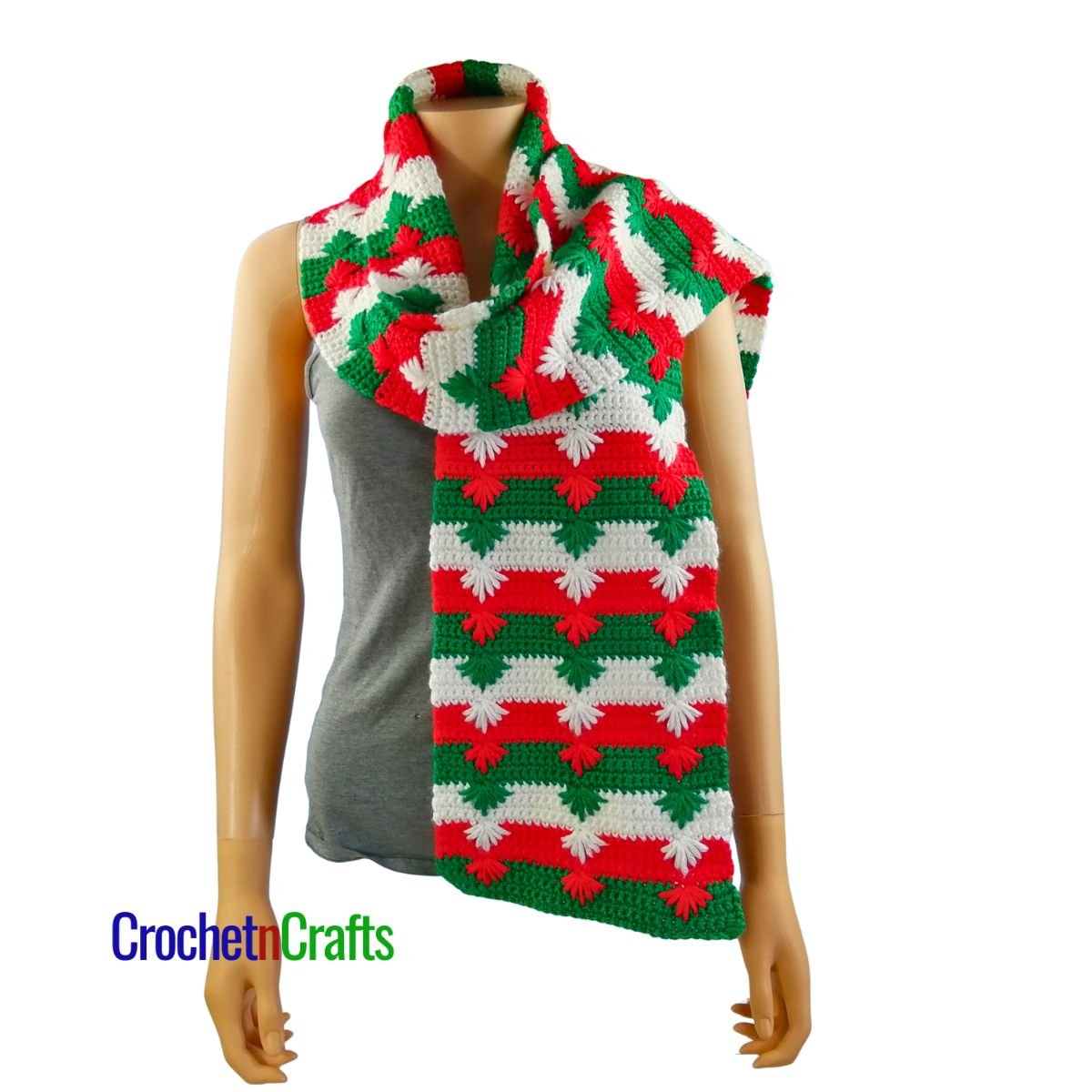 A Christmas crochet scarf draped over the shoulder.