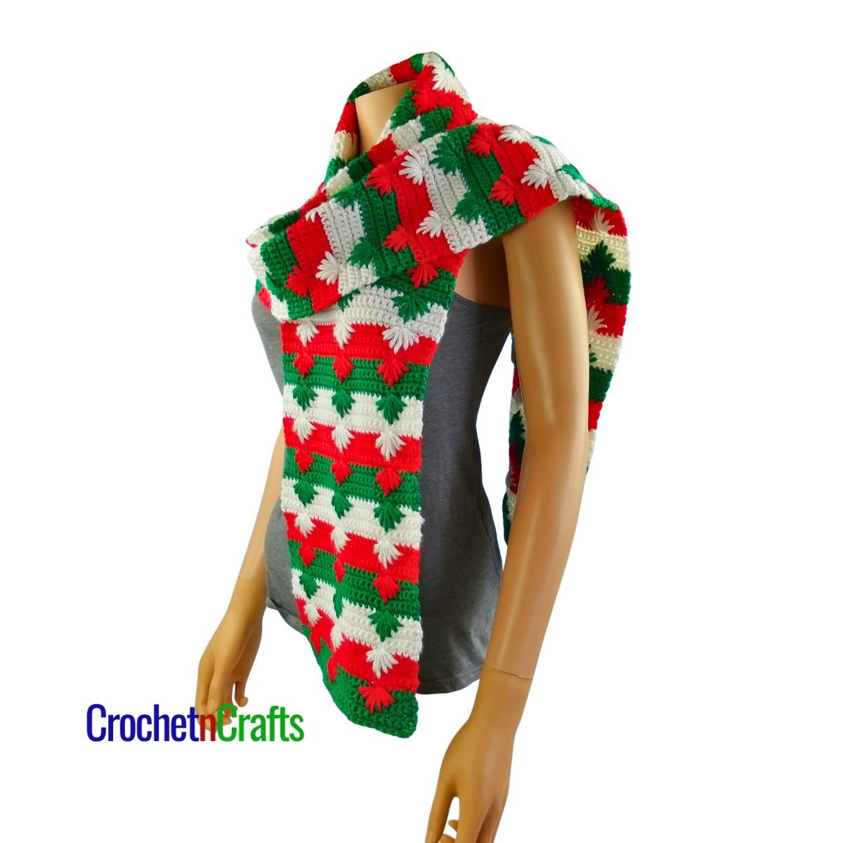 A Christmas crochet scarf draped over the shoulder - side view.