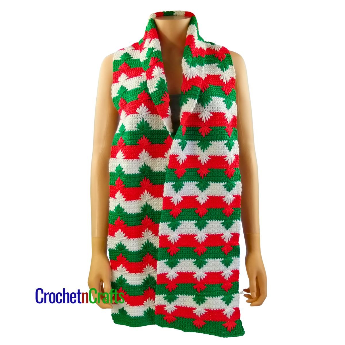 A Christmas crochet scarf worn long.