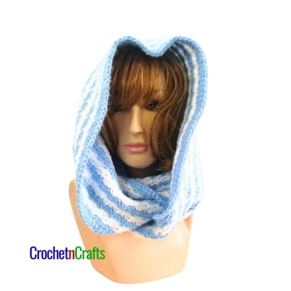 A crocheted cowl worn as a hooded cowl.