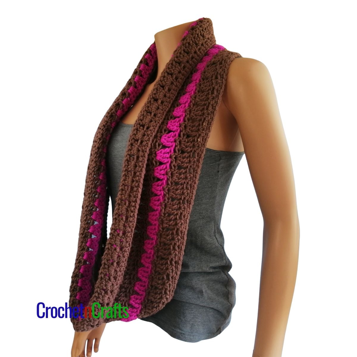 A crocheted cowl worn long like a scarf.