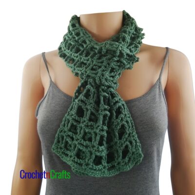 A light summer crochet scarf looped around the neck.