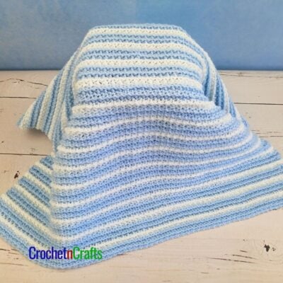 Crochet Baby Blanket Draped Over a Child's Stool.