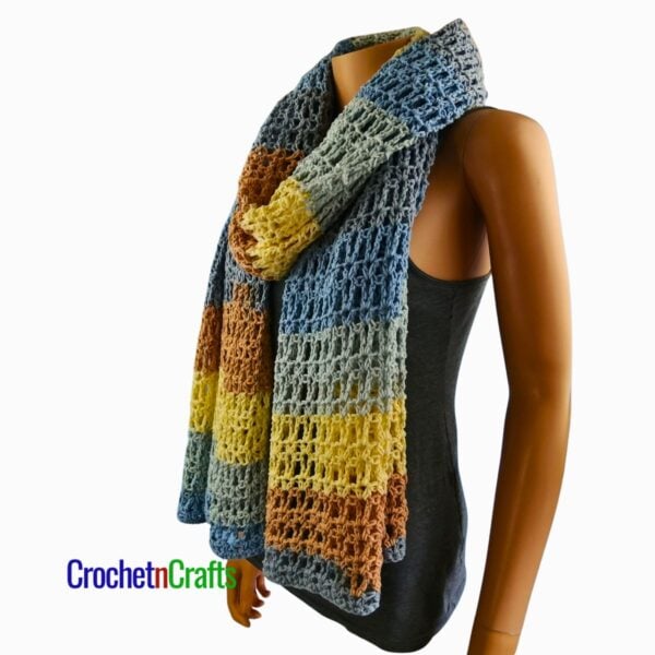 Crochet Prayer Shawl Pattern - Vienna The crocheted shawl is bunched up like a scarf and worn by a mannequin.