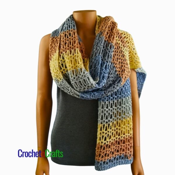 Crochet Prayer Shawl Pattern - Vienna The crocheted shawl is draped over a mannequin.