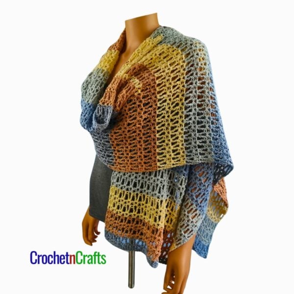Crochet Prayer Shawl Pattern - Vienna The crocheted shawl is draped over a mannequin.